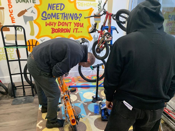 A picture of resident repairing bike