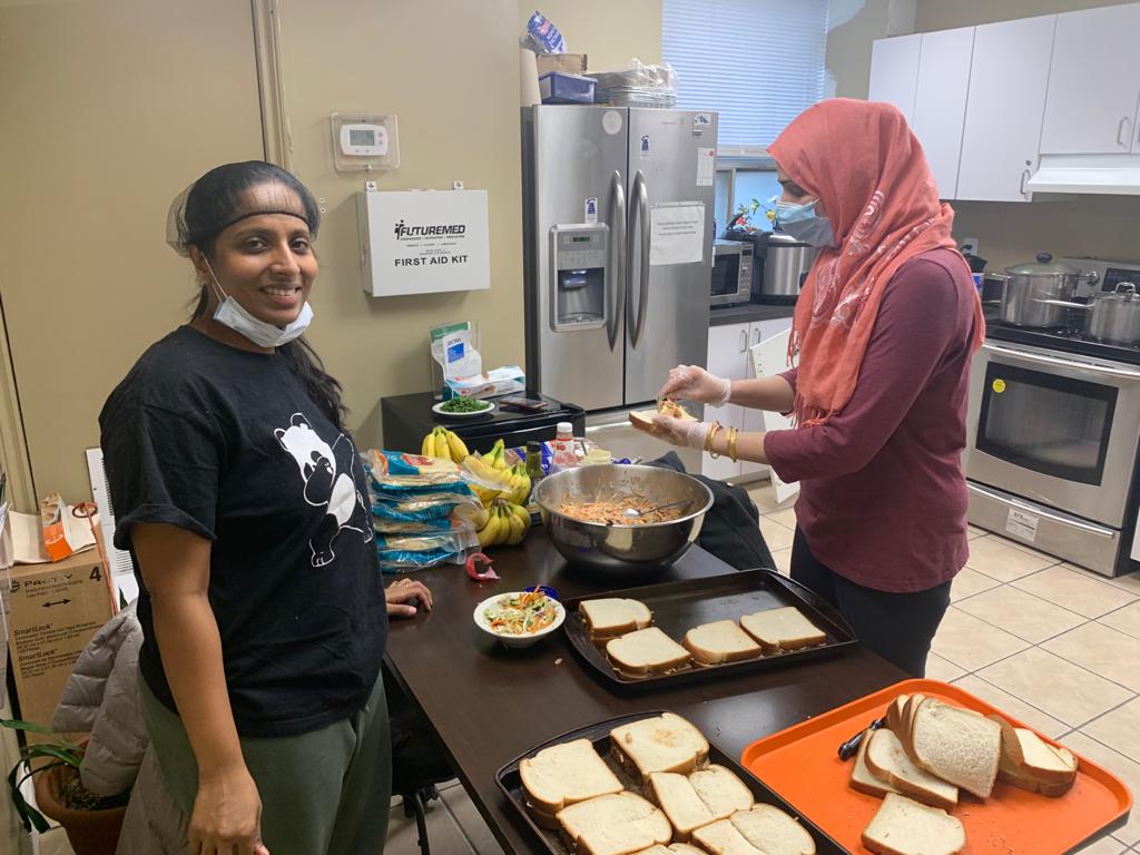 picture of a lady making sandwhiches